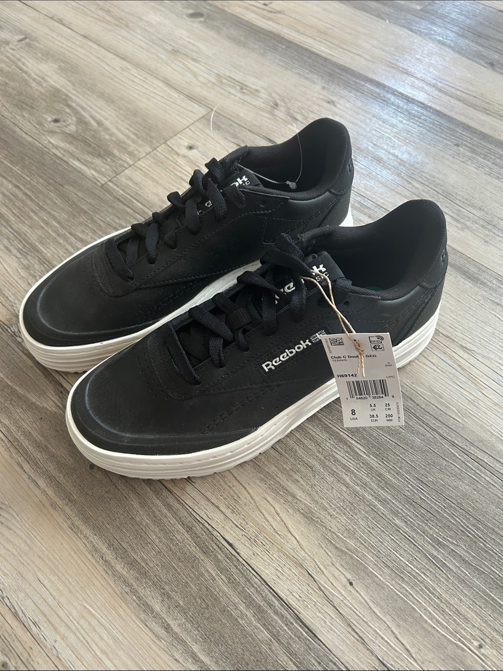 Reebok Women’s Black Sneakers with White Sole